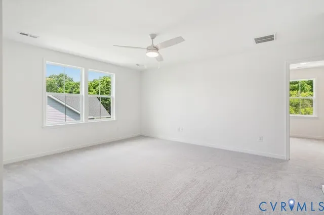 a bathroom with a shower sink and mirror