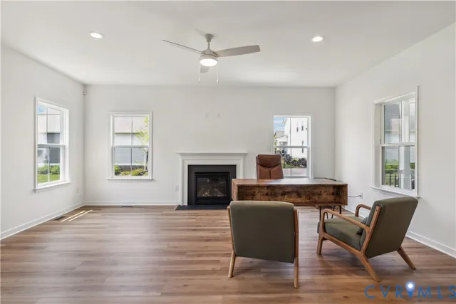 a living room with furniture and a fireplace