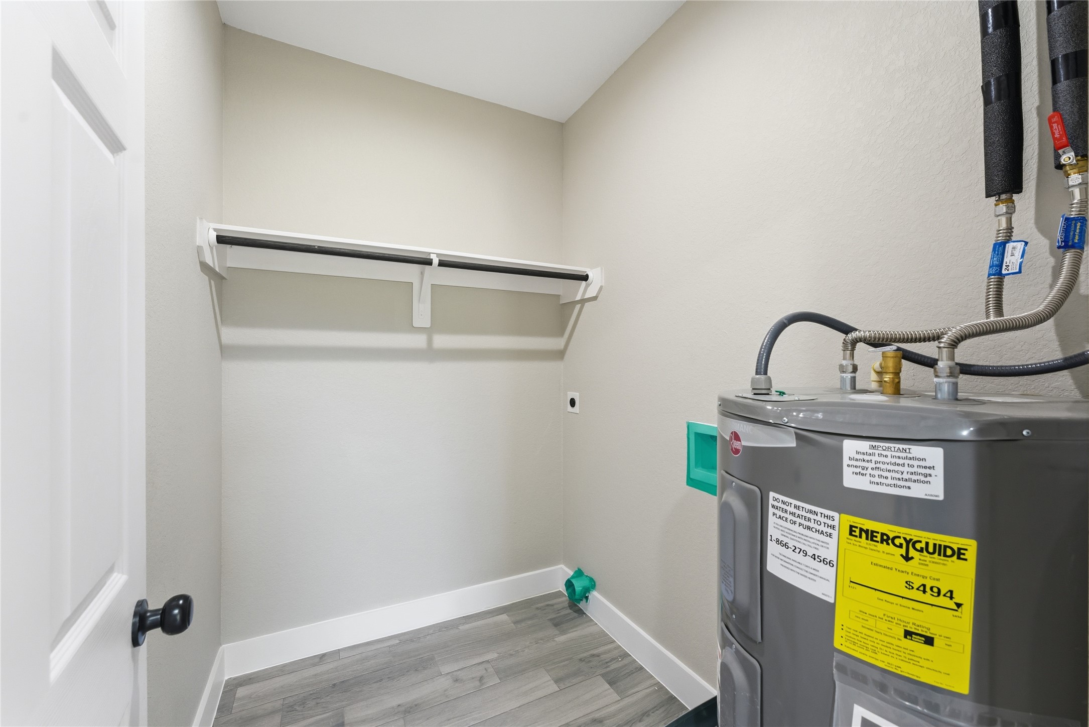 9722 Tuffly Street Houston, TX 77029 - Photo 12 of 16 a room with storage and utility