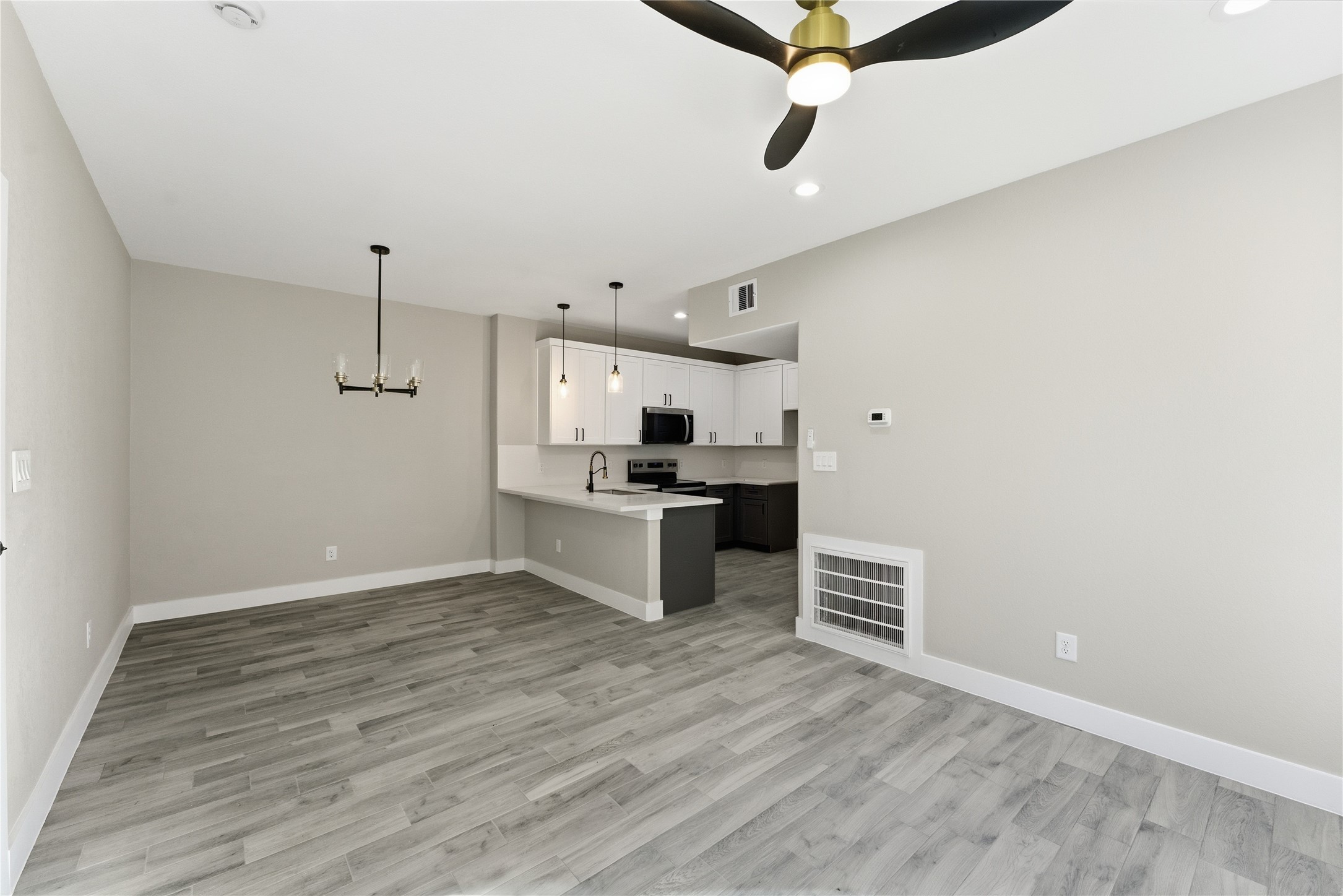 9722 Tuffly Street Houston, TX 77029 - Photo 4 of 16 a kitchen with granite countertop a sink cabinets and stainless steel appliances