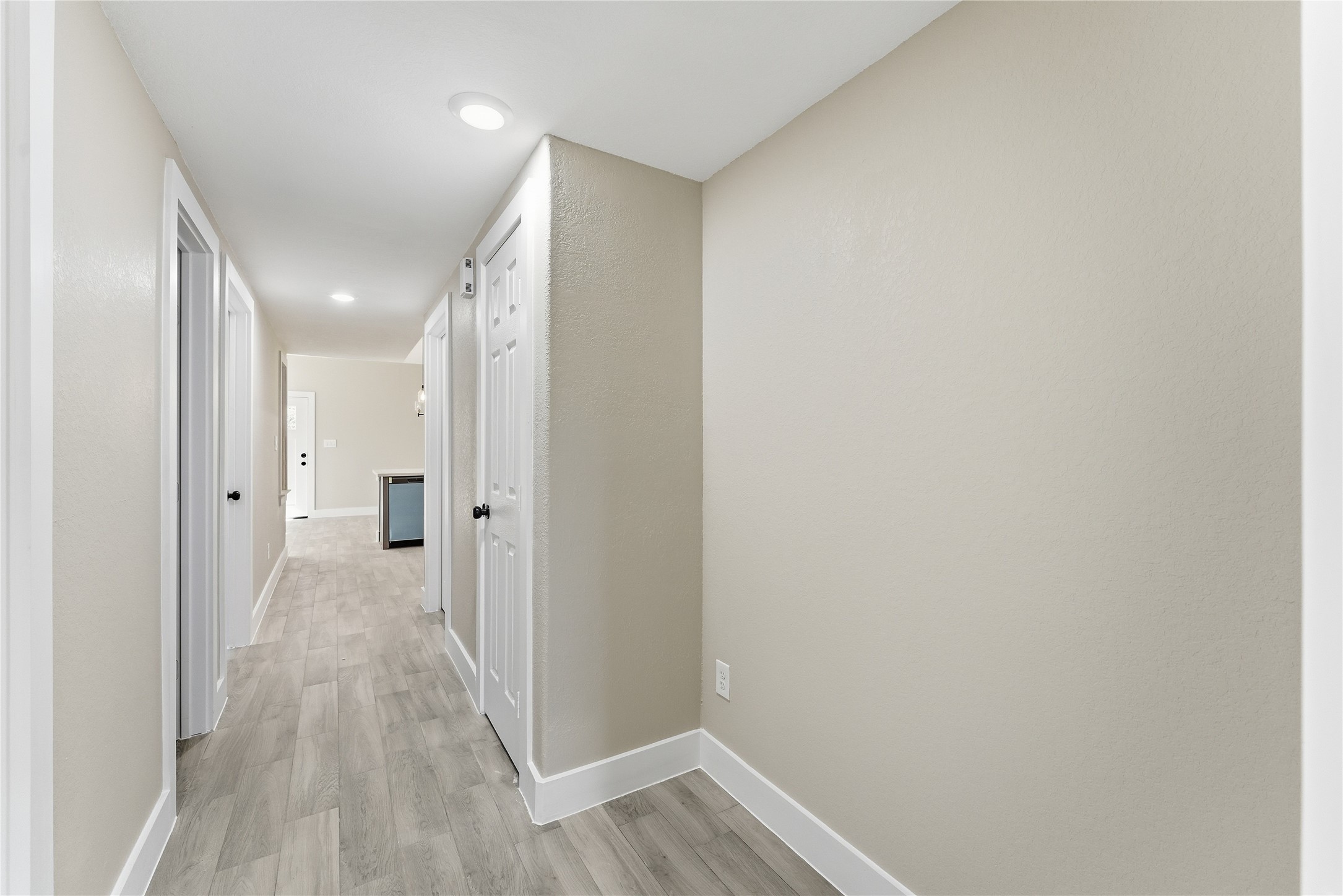 9722 Tuffly Street Houston, TX 77029 - Photo 5 of 16 a view of a hallway with wooden floor