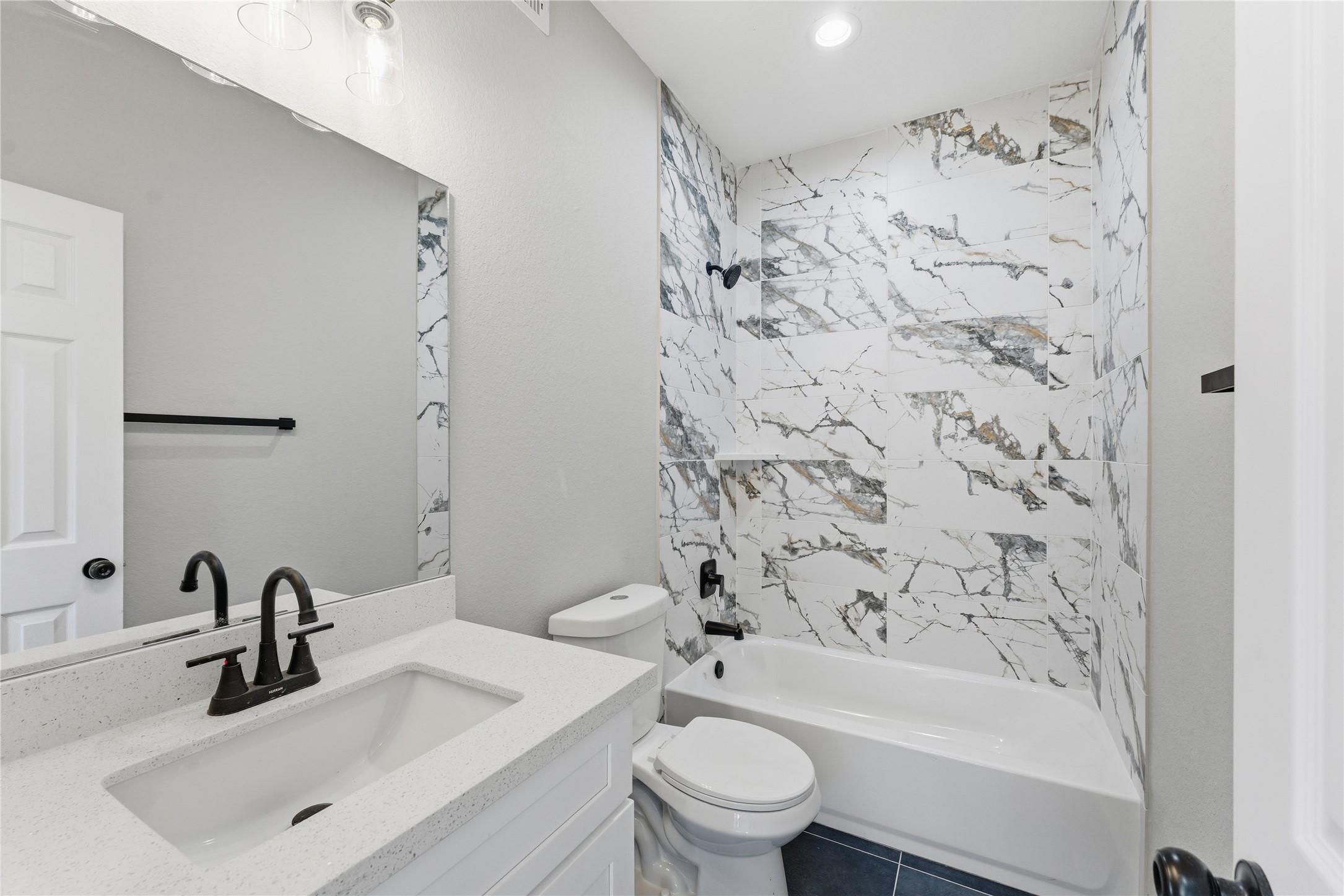 9722 Tuffly Street Houston, TX 77029 - Photo 6 of 16 a bathroom with a sink a toilet and shower