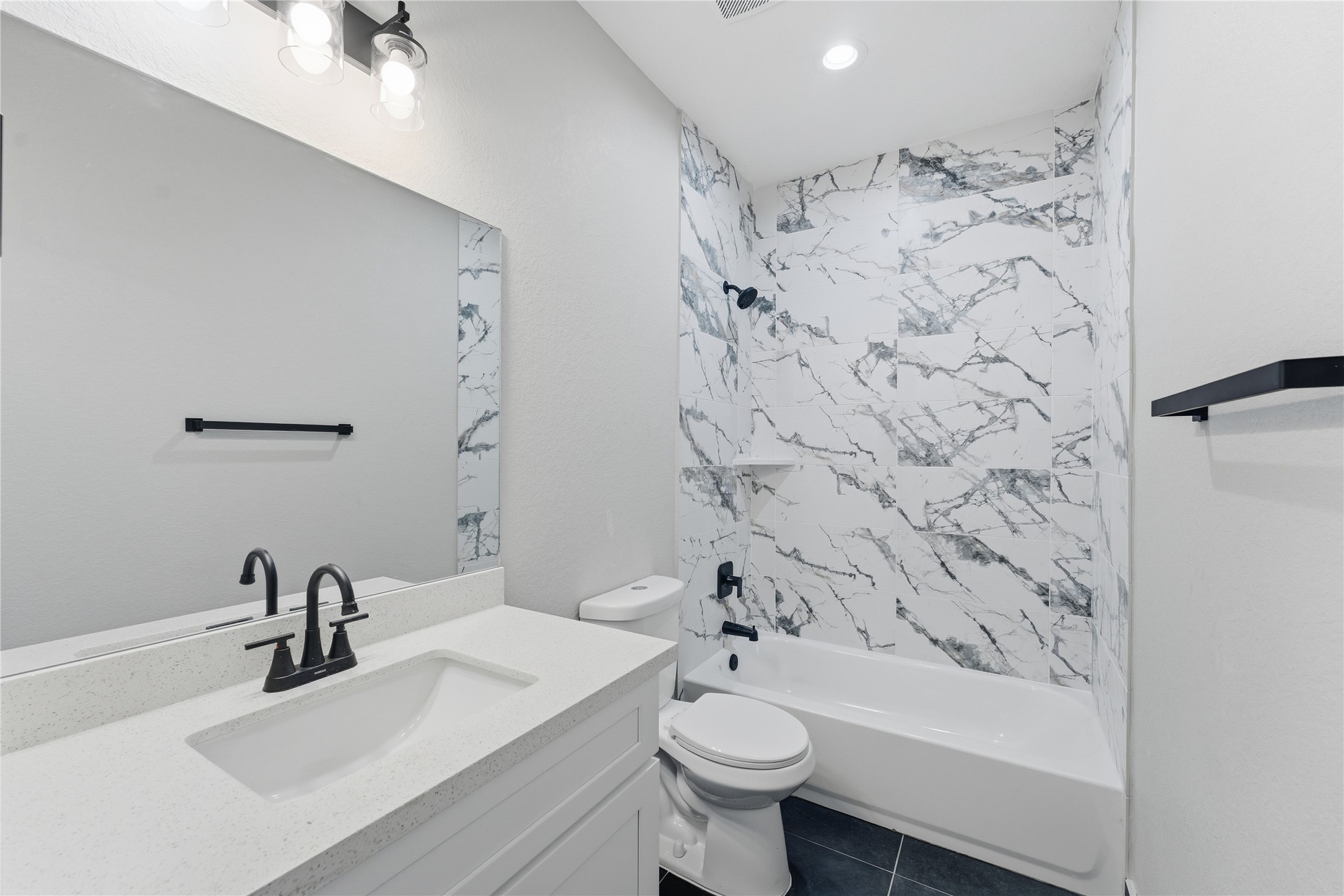 9722 Tuffly Street Houston, TX 77029 - Photo 10 of 16 a bathroom with a sink toilet and shower