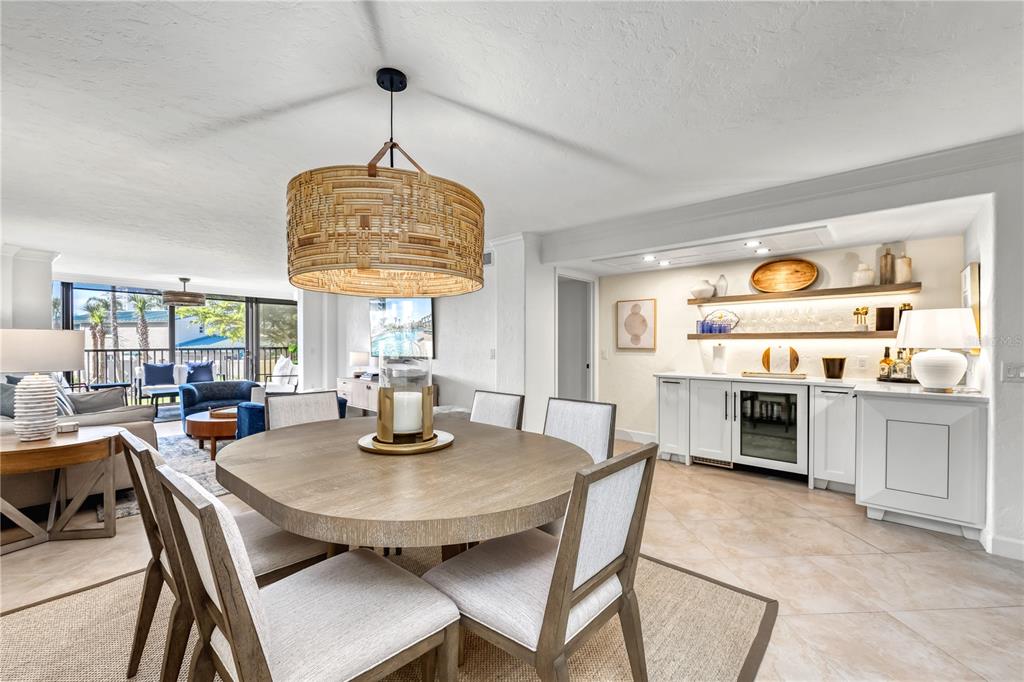 5880 Midnight Pass Road, Unit 210 Sarasota, FL 34242 - Photo 14 of 75 a view of a dining room with furniture window and outside view