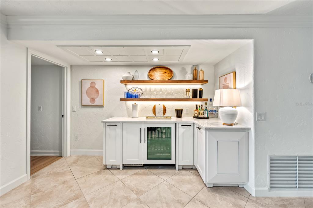 5880 Midnight Pass Road, Unit 210 Sarasota, FL 34242 - Photo 15 of 75 a kitchen with stainless steel appliances granite countertop a stove and a sink