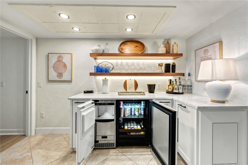 5880 Midnight Pass Road, Unit 210 Sarasota, FL 34242 - Photo 16 of 75 a kitchen with stainless steel appliances granite countertop a stove and cabinets