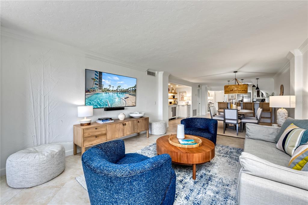 5880 Midnight Pass Road, Unit 210 Sarasota, FL 34242 - Photo 17 of 75 a living room with furniture and a rug