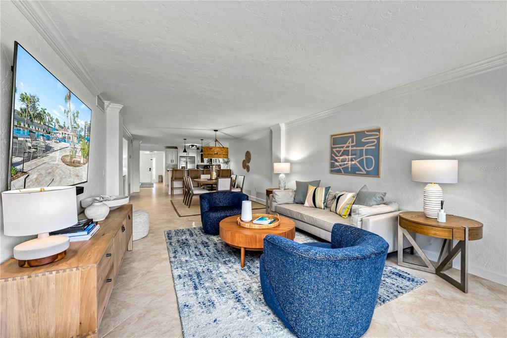 5880 Midnight Pass Road, Unit 210 Sarasota, FL 34242 - Photo 19 of 75 a living room with furniture and a window