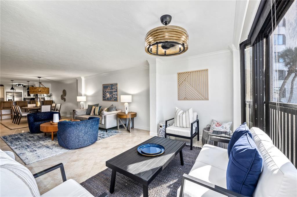 5880 Midnight Pass Road, Unit 210 Sarasota, FL 34242 - Photo 21 of 75 a living room with furniture and a window