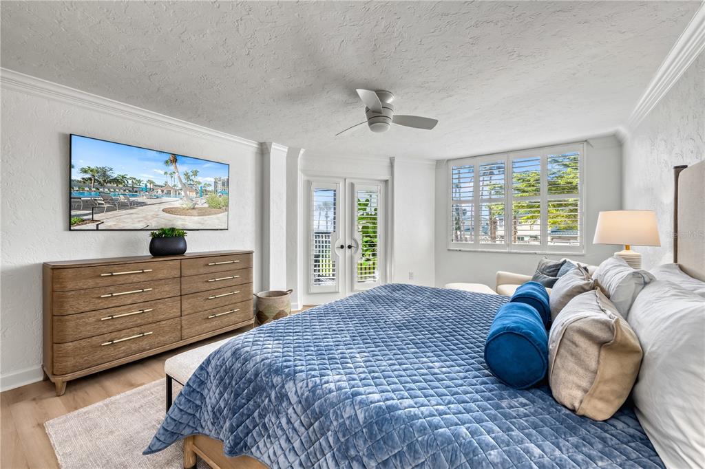 5880 Midnight Pass Road, Unit 210 Sarasota, FL 34242 - Photo 24 of 75 a bedroom with a bed and a window