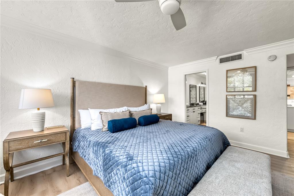 5880 Midnight Pass Road, Unit 210 Sarasota, FL 34242 - Photo 27 of 75 a bedroom with a bed and window