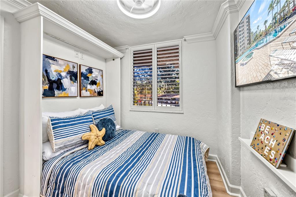 5880 Midnight Pass Road, Unit 210 Sarasota, FL 34242 - Photo 39 of 75 a bedroom with a bed and a window