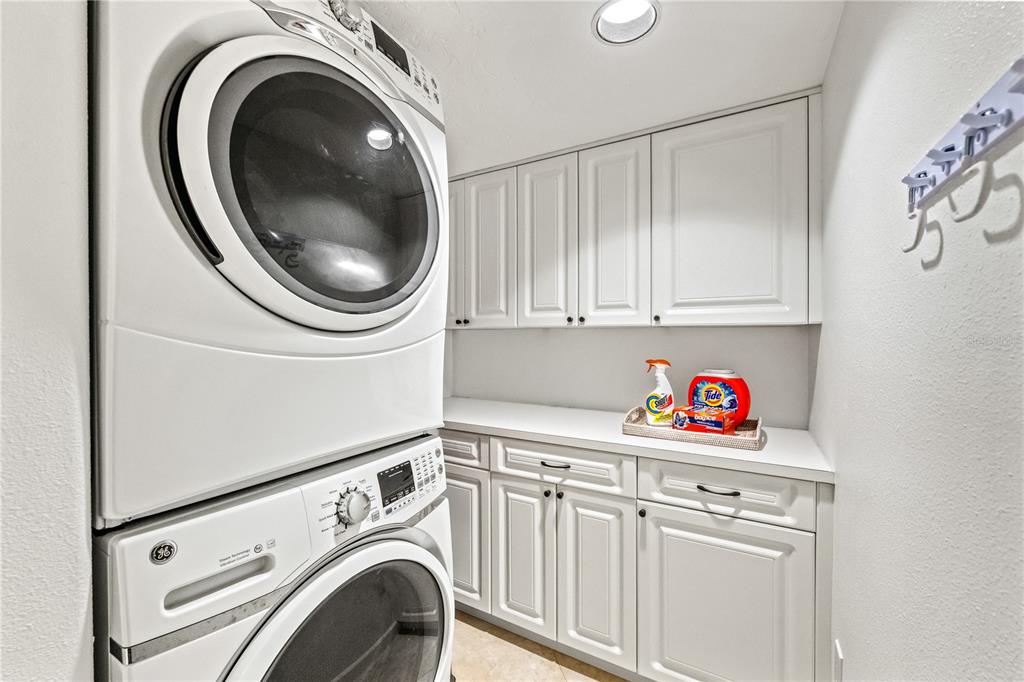 5880 Midnight Pass Road, Unit 210 Sarasota, FL 34242 - Photo 42 of 75 a utility room with dryer and washer