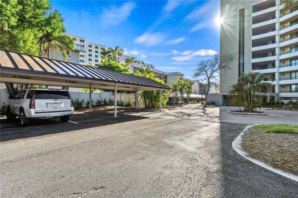 5880 Midnight Pass Road, Unit 210 Sarasota, FL 34242 - Photo 44 of 75 a view of a cars park in front of a building