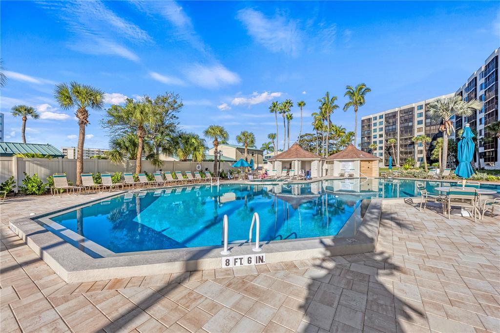5880 Midnight Pass Road, Unit 210 Sarasota, FL 34242 - Photo 51 of 75 a view of swimming pool with outdoor seating and city view