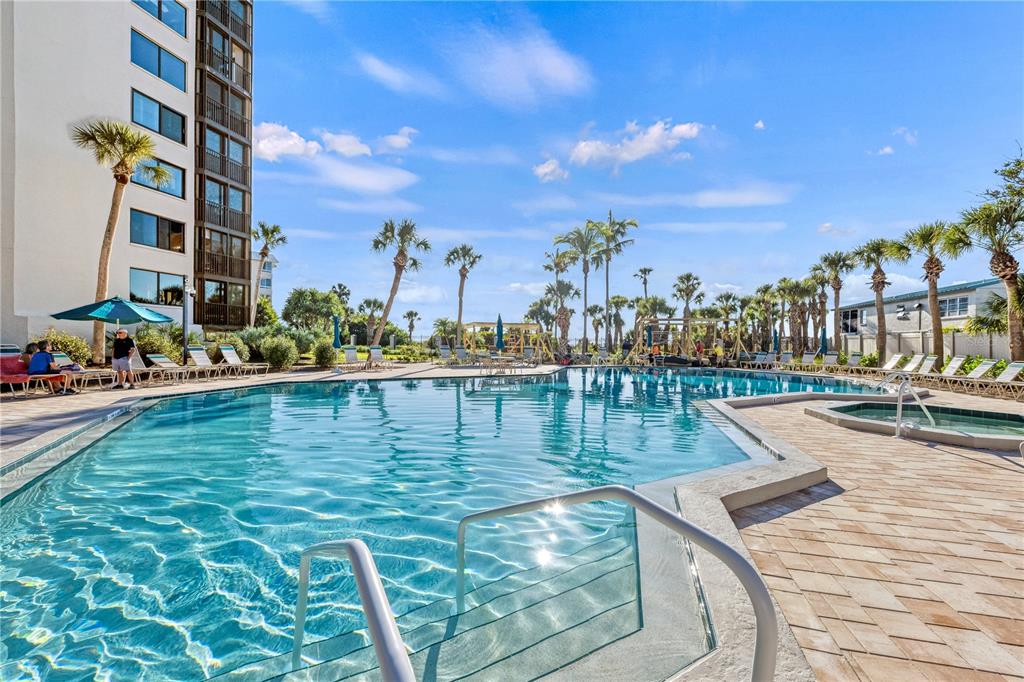 5880 Midnight Pass Road, Unit 210 Sarasota, FL 34242 - Photo 53 of 75 a view of swimming pool with outdoor seating and city view