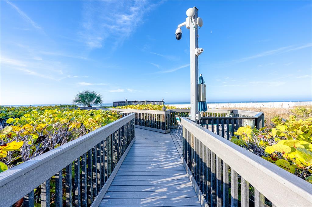 5880 Midnight Pass Road, Unit 210 Sarasota, FL 34242 - Photo 54 of 75 a view of a balcony with wooden floor