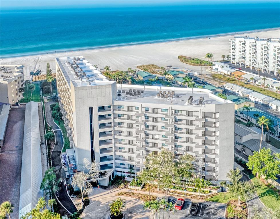 5880 Midnight Pass Road, Unit 210 Sarasota, FL 34242 - Photo 74 of 75 a view of building with an outdoor space