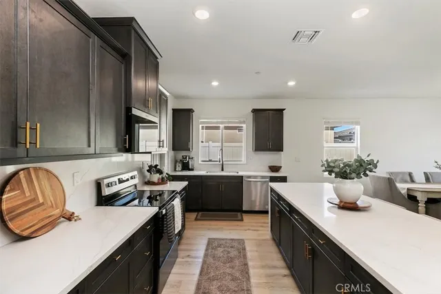 a kitchen with lots of counter space and appliances