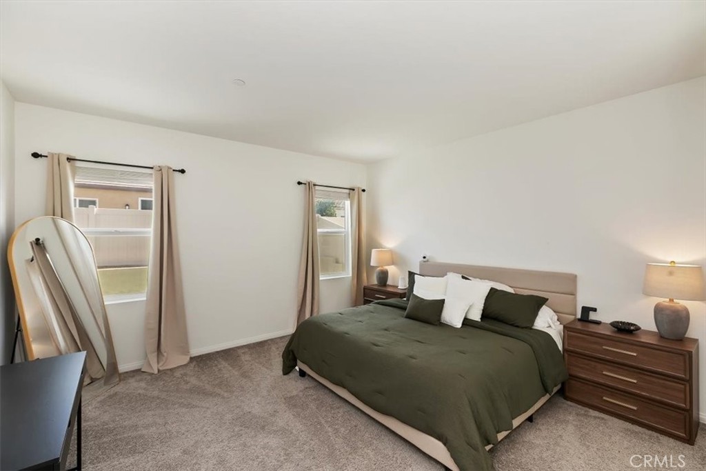 29224 Outback Lane Winchester, CA 92596 - Photo 19 of 35 a bedroom with a bed and wooden floor