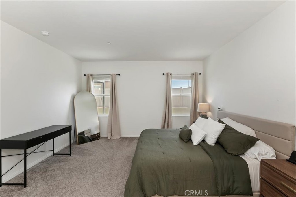 29224 Outback Lane Winchester, CA 92596 - Photo 20 of 35 a bedroom with a bed and a mirror