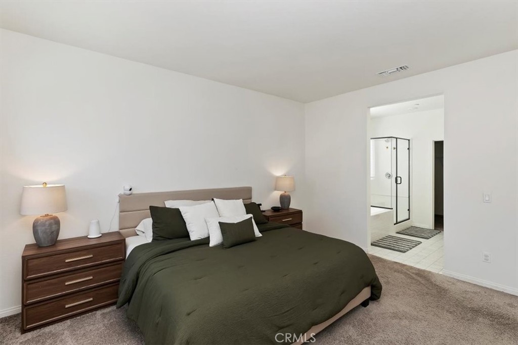 29224 Outback Lane Winchester, CA 92596 - Photo 21 of 35 a bedroom with a bed and wooden floor