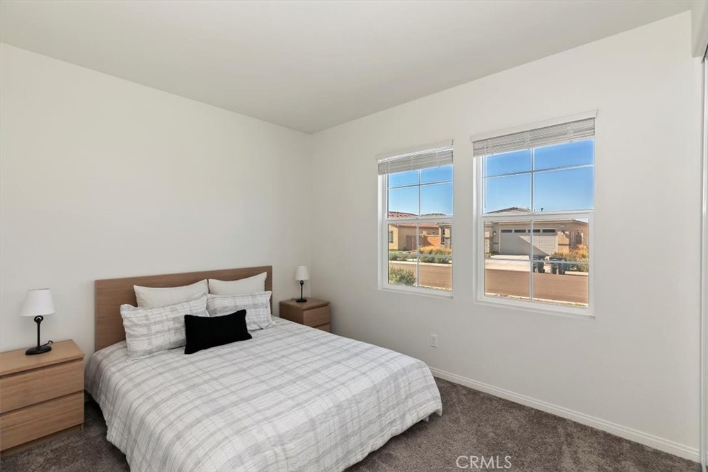 29224 Outback Lane Winchester, CA 92596 - Photo 24 of 35 a bedroom with a bed and a window