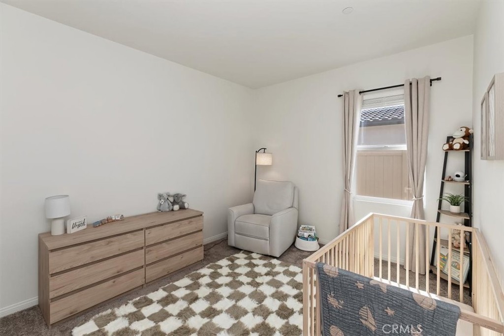 29224 Outback Lane Winchester, CA 92596 - Photo 26 of 35 a bedroom with furniture and wooden floor