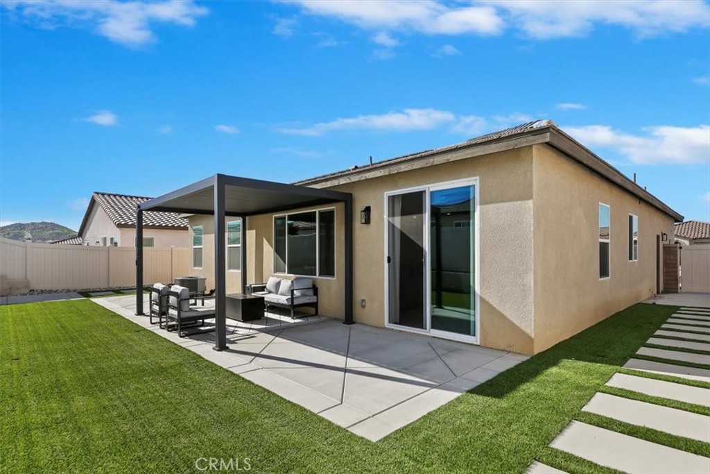 29224 Outback Lane Winchester, CA 92596 - Photo 29 of 35 a view of a house with backyard sitting area and garden
