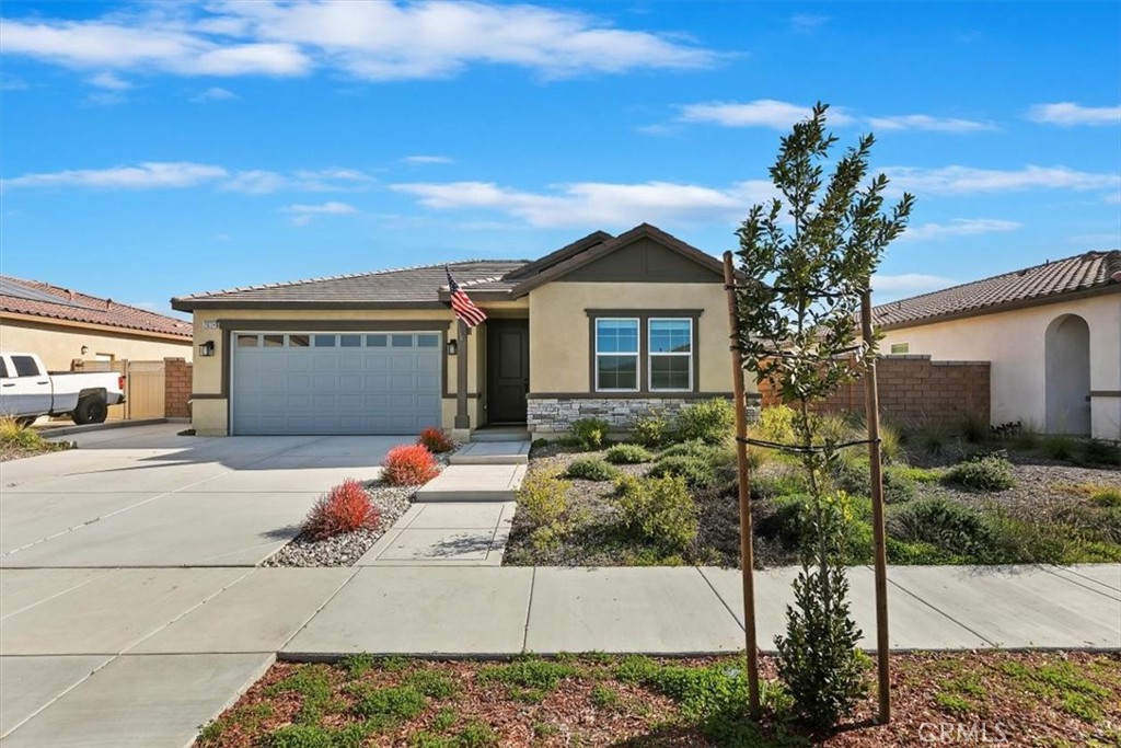 29224 Outback Lane Winchester, CA 92596 - Photo 4 of 35 a front view of a house with a garage