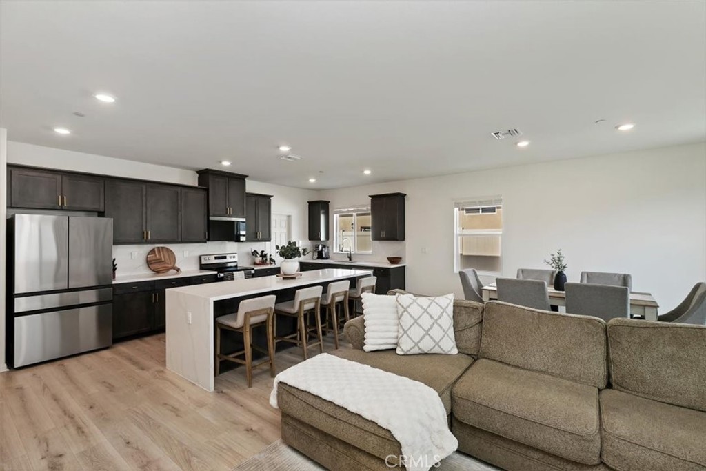 29224 Outback Lane Winchester, CA 92596 - Photo 7 of 35 a living room with furniture and kitchen view