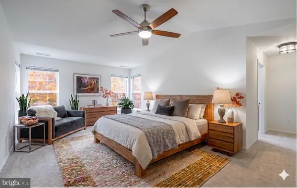 a bedroom with a bed and a cabinets