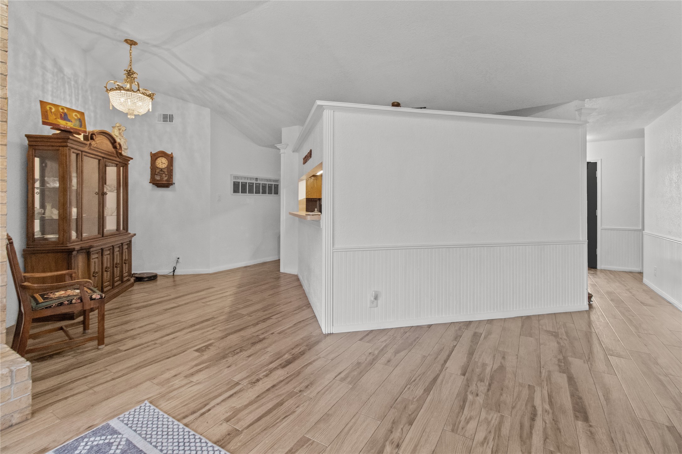 9 Colony Square Angleton, TX 77515 - Photo 11 of 23 an empty room with wooden floor and a ceiling fan