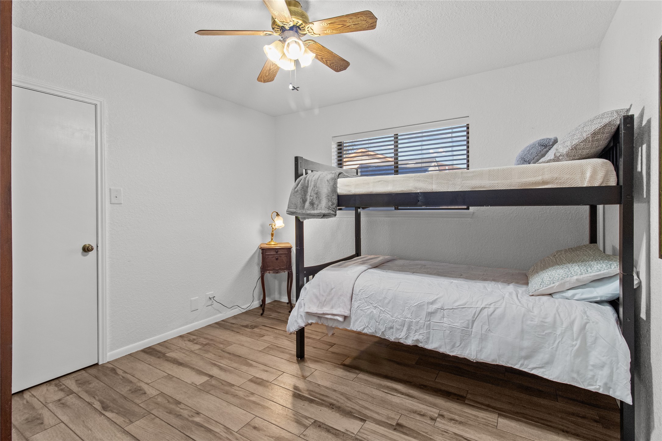 9 Colony Square Angleton, TX 77515 - Photo 13 of 23 a bedroom with a bed and a chandelier