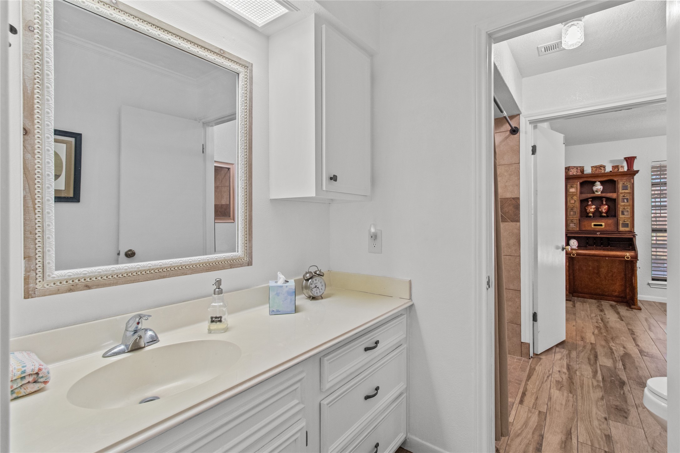 9 Colony Square Angleton, TX 77515 - Photo 14 of 23 a bathroom with a sink double vanity and a mirror