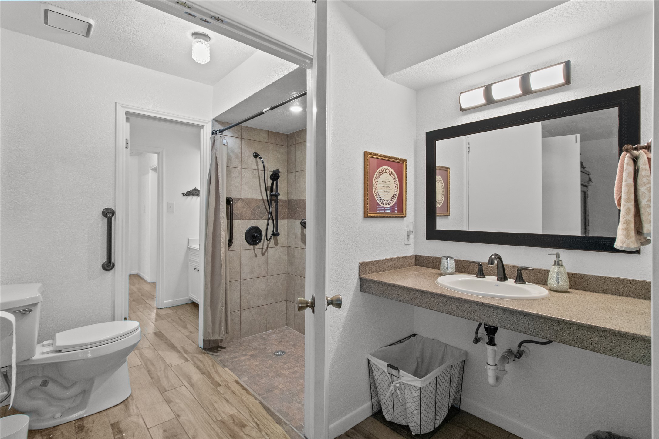 9 Colony Square Angleton, TX 77515 - Photo 15 of 23 a bathroom with a toilet sink and shower