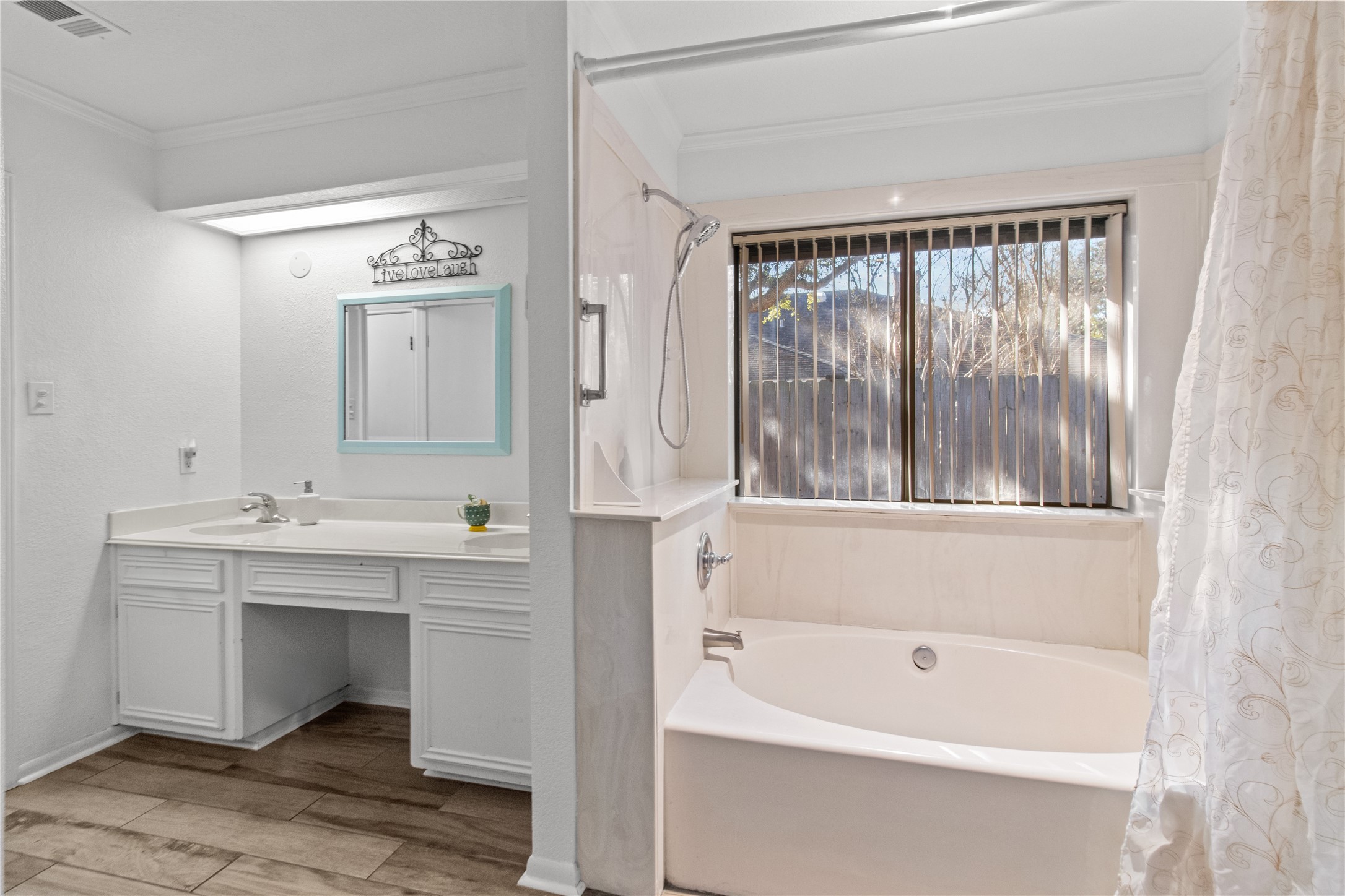9 Colony Square Angleton, TX 77515 - Photo 20 of 23 a bathroom with a tub sink and mirror