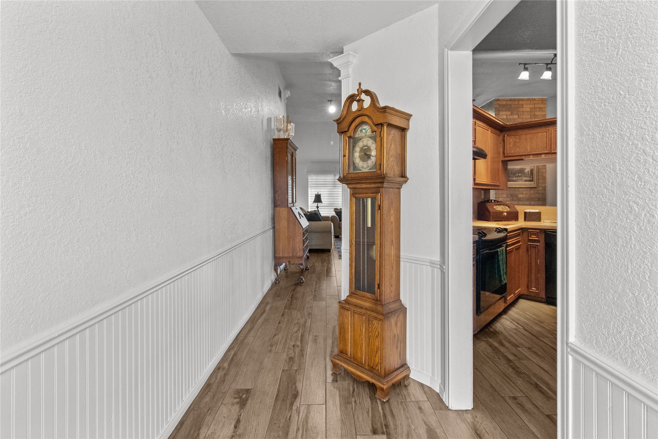 9 Colony Square Angleton, TX 77515 - Photo 5 of 23 a view of a hallway with wooden floor and closet