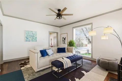 a living room with furniture and a window