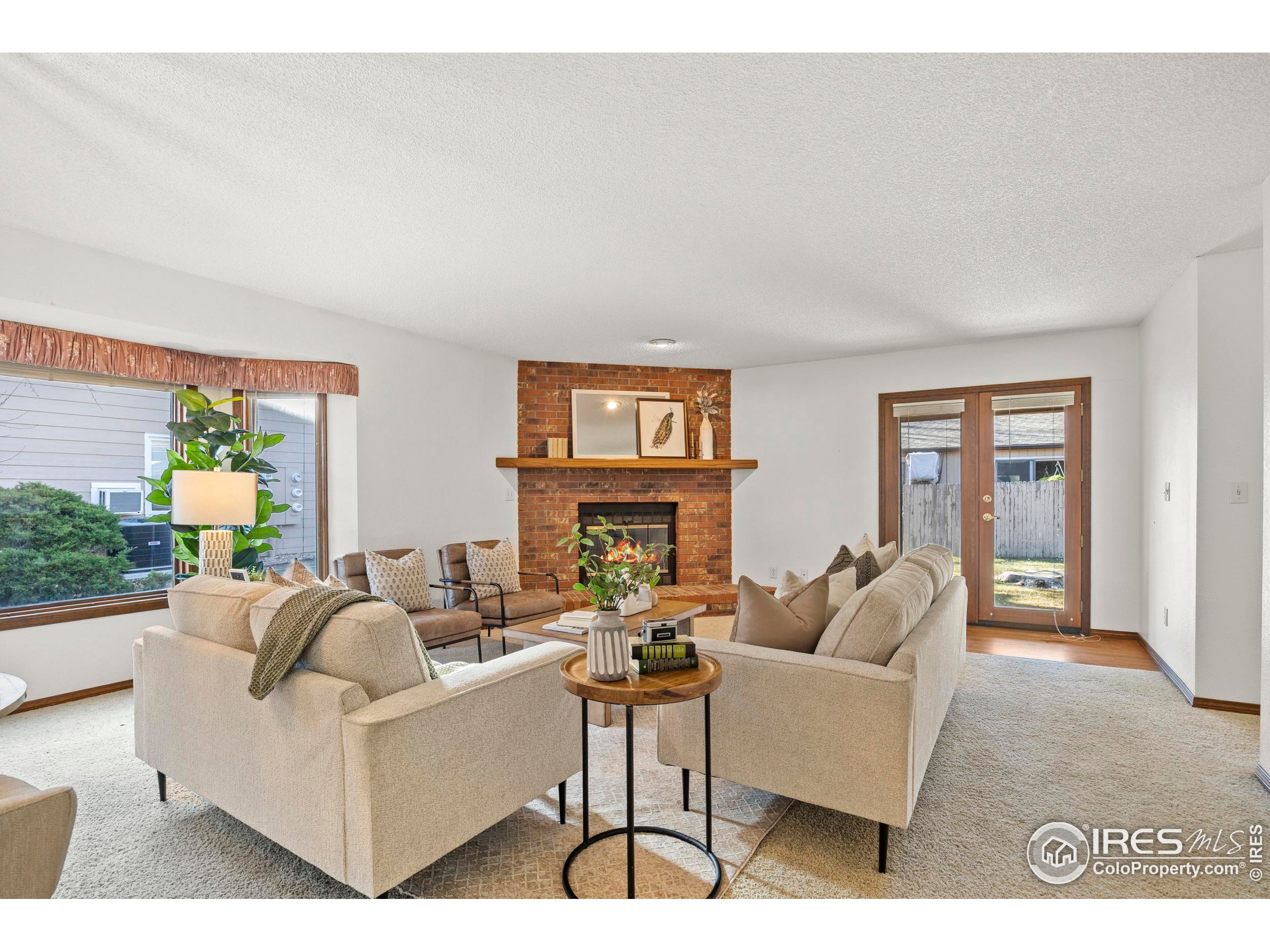 903 Conifer Court Windsor, CO 80550 - Photo 16 of 33 a living room with furniture and wooden floor