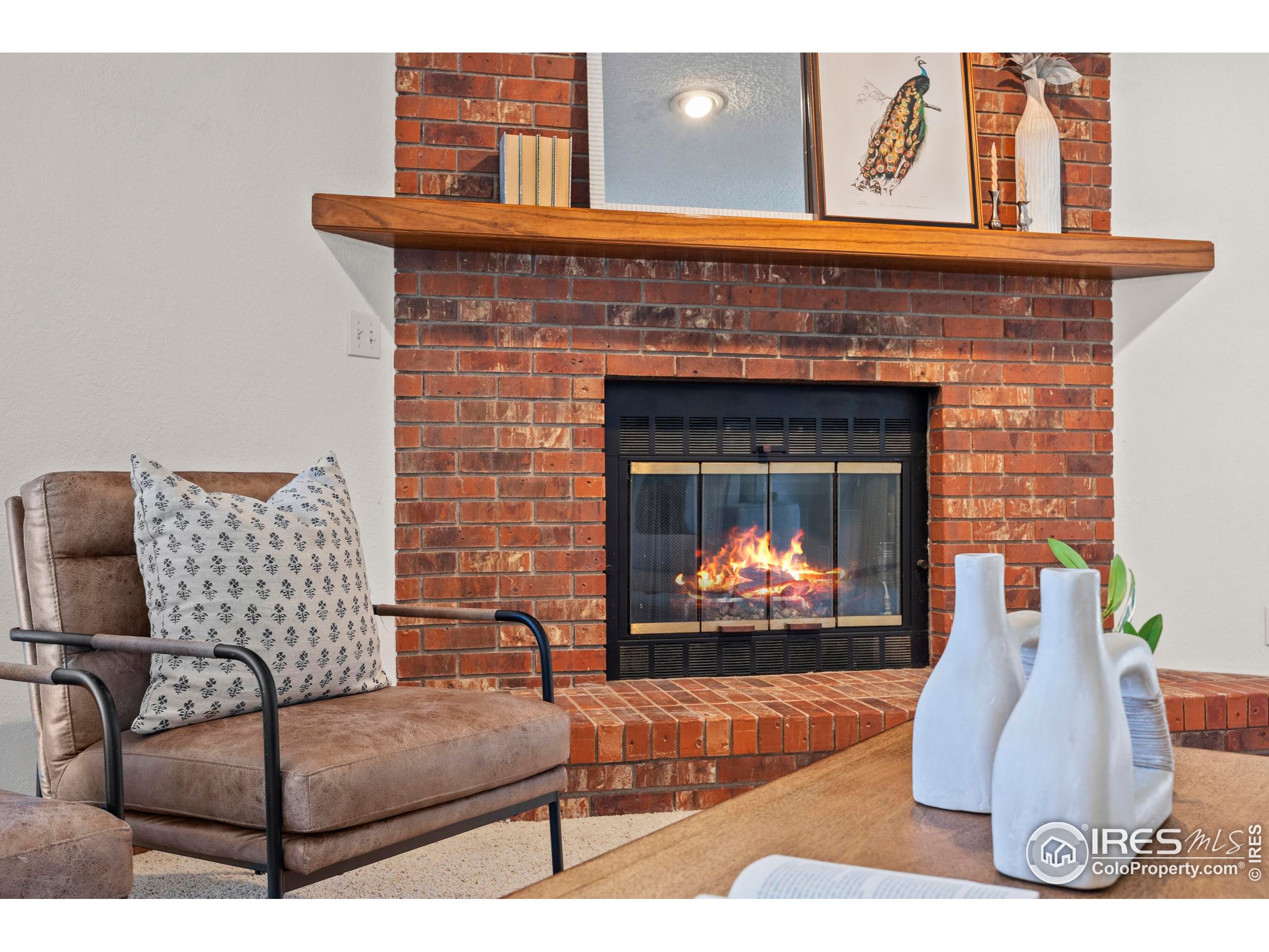 903 Conifer Court Windsor, CO 80550 - Photo 17 of 33 a living room with furniture and a fireplace
