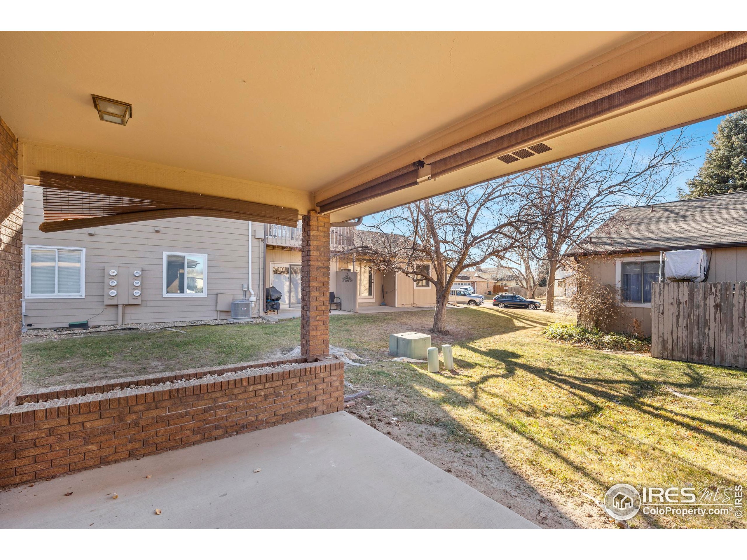 903 Conifer Court Windsor, CO 80550 - Photo 32 of 33 a view of a house with a yard