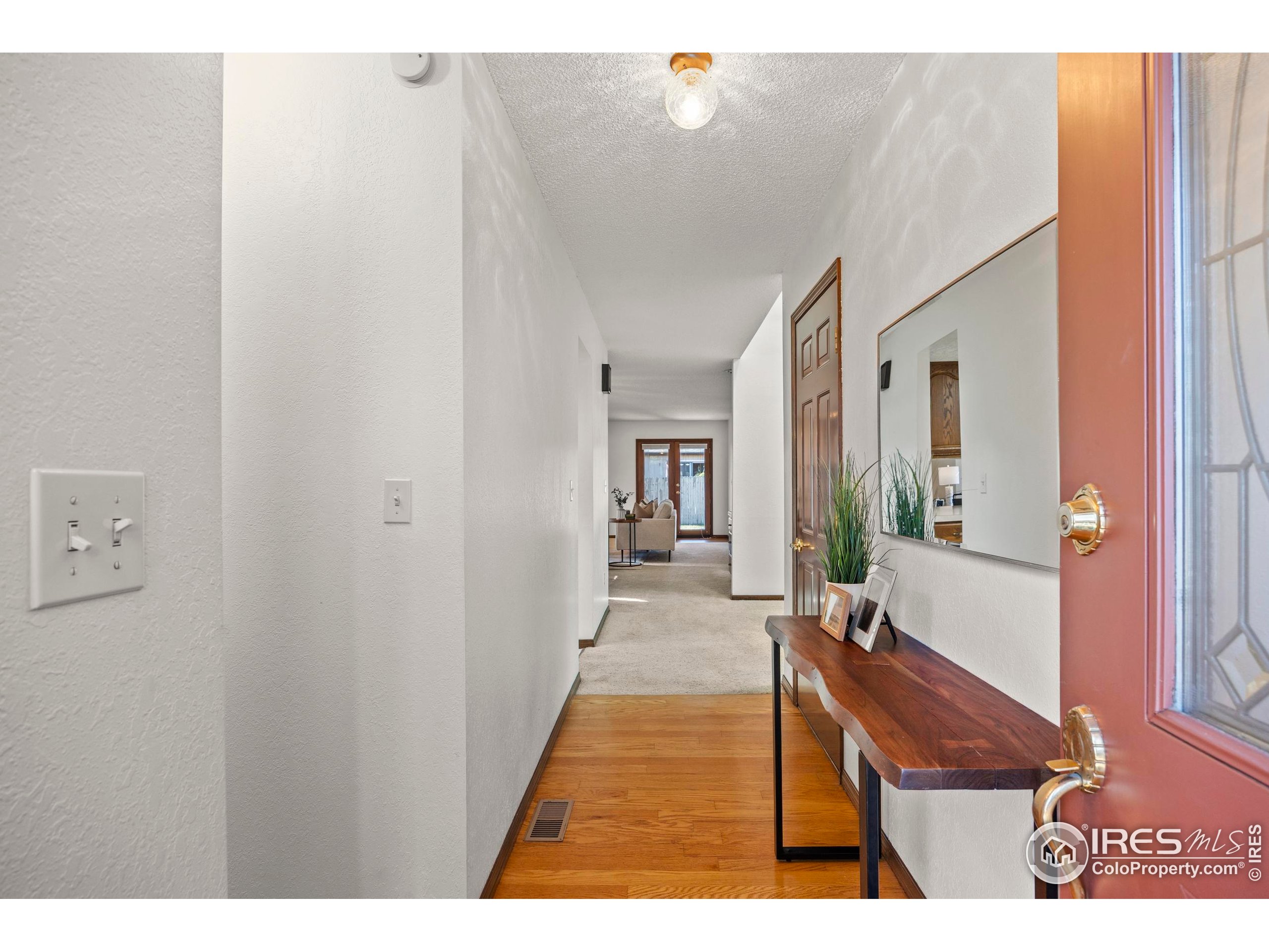 903 Conifer Court Windsor, CO 80550 - Photo 6 of 33 a view of a living room and bathroom