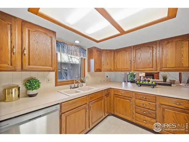 a kitchen with sink cabinets and window