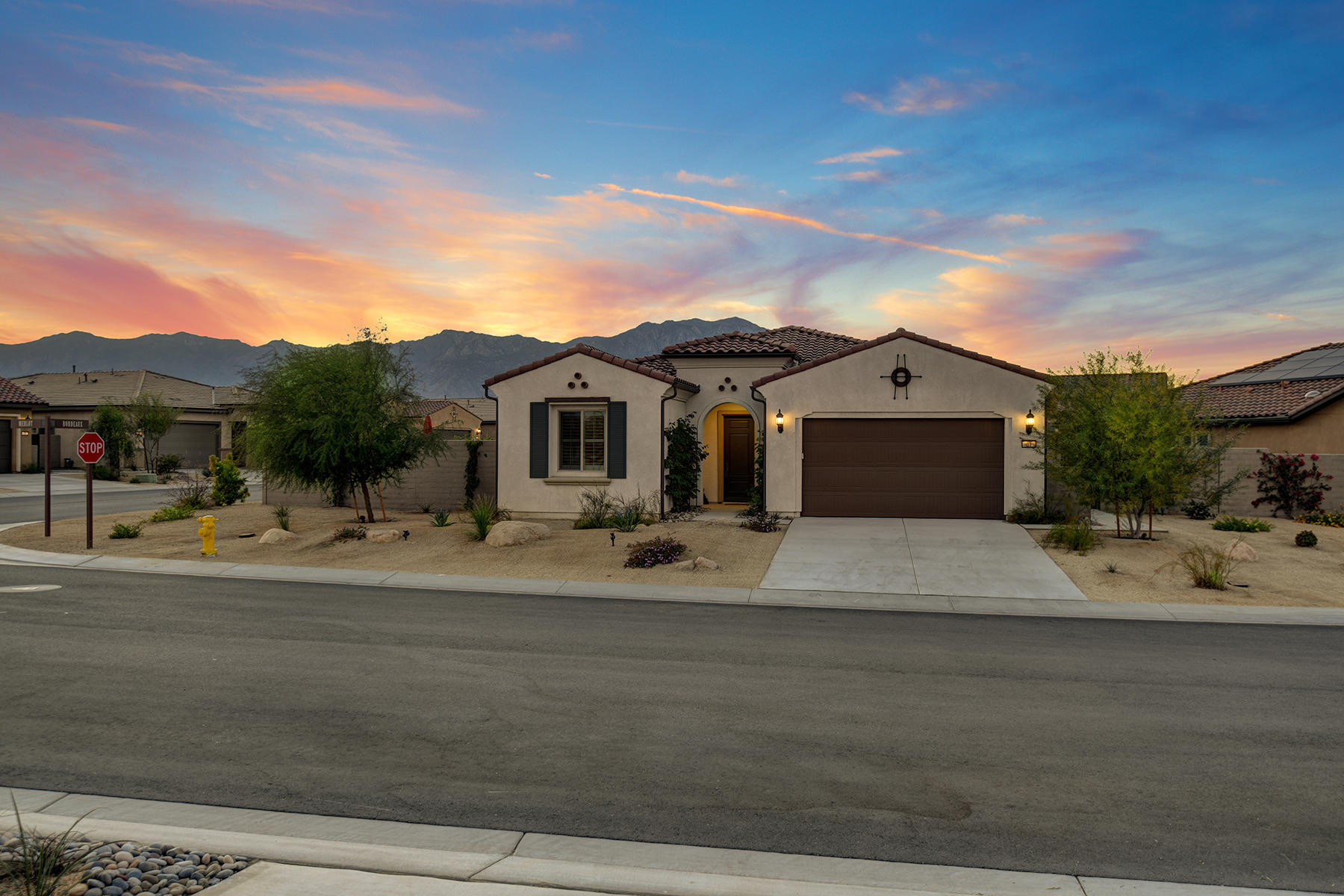 51 Merlot Rancho Mirage, CA 92270 - Photo 2 of 50 002 FRONT OF HOUSE TO MOUNTAINS NIGHT ML