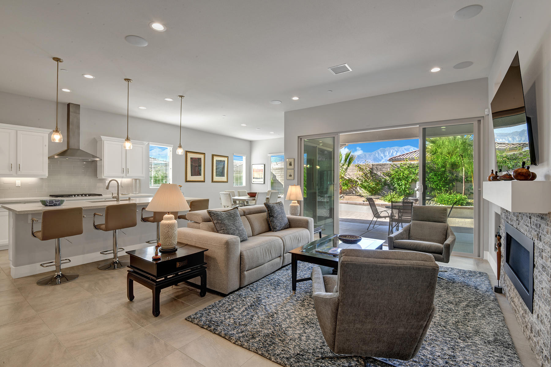 51 Merlot Rancho Mirage, CA 92270 - Photo 4 of 50 004 LIVING ROOM TO KITCHEN AND DINING RO