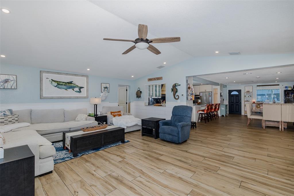 8211 Hayward Lane Port Richey, FL 34668 - Photo 11 of 65 a living room with furniture and a wooden floor