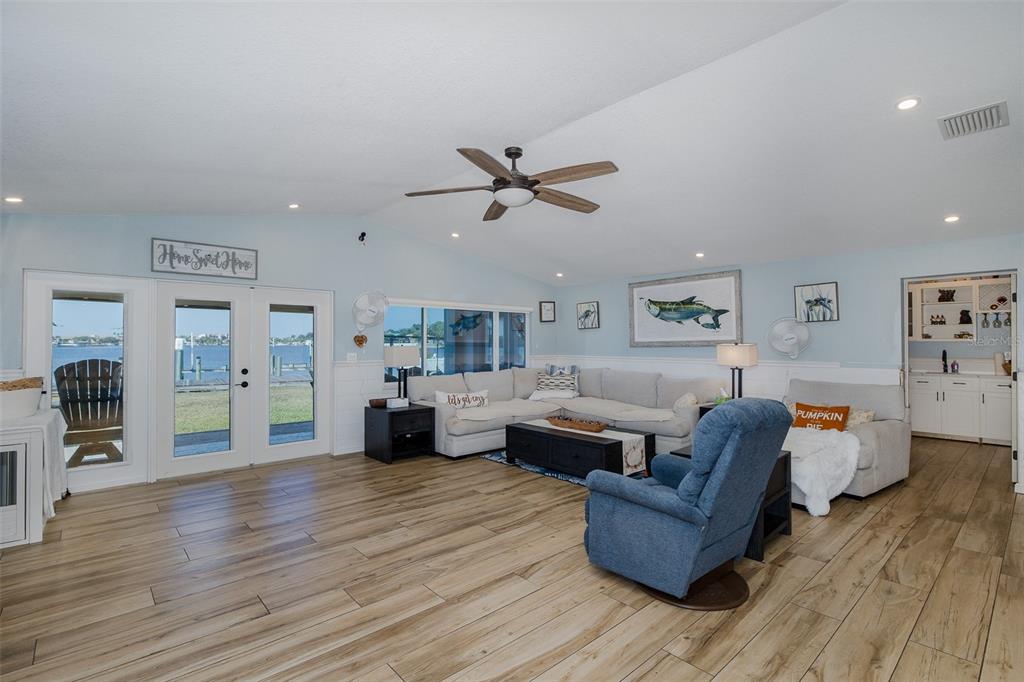 8211 Hayward Lane Port Richey, FL 34668 - Photo 12 of 65 a living room with furniture and wooden floor