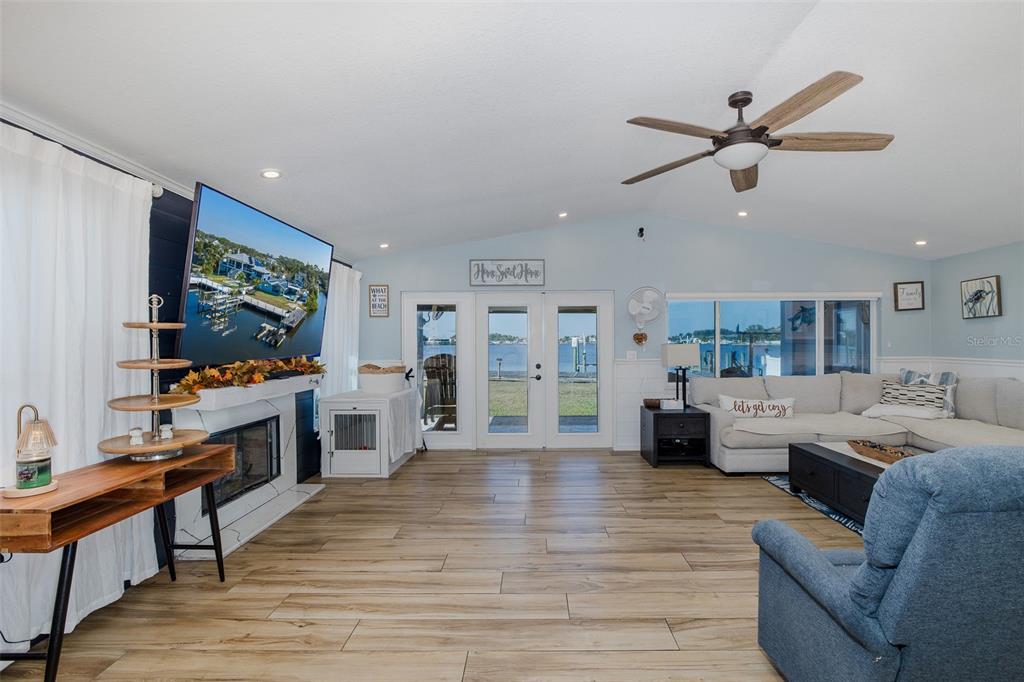 8211 Hayward Lane Port Richey, FL 34668 - Photo 14 of 65 a living room with furniture and a flat screen tv