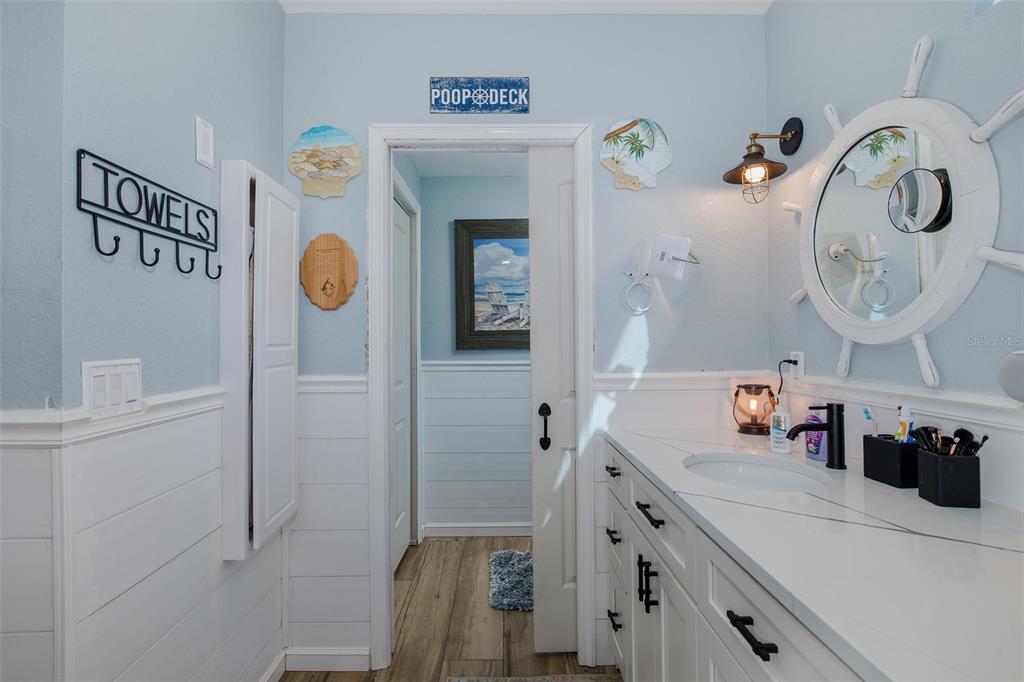8211 Hayward Lane Port Richey, FL 34668 - Photo 22 of 65 a bathroom with a sink and a mirror